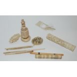 A small collection of late 19th/early 20th Century carved ivory pieces including chess piece, needle