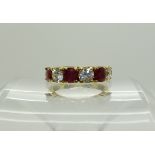 A continental bright yellow metal ruby and clear gem ring, size P, weight 5gms Condition Report: