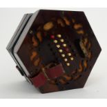 A Wheatstone concertina with forty-eight buttons, pierced rosewood ends with makers stamp and