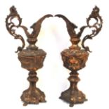 A pair of coppered metal decorative ewers Condition Report: Available upon request