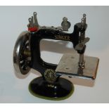 A vintage mini Singer sewing machine for girls in original box and pictorial box (2) Condition