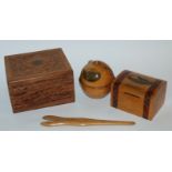 A Mauchline ware money box, thread holder, glove stretchers and carved box (4) Condition Report: