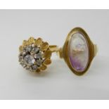 A 14k gold amethyst set ring O, a bright yellow metal clear gem set cluster ring, size N, combined