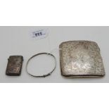 A lot comprising a silver cigarette case, a vesta and a bangle (3), 101gms weighable Condition