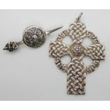 A silver sword and shield brooch by CAI Iona, and a Celtic cross pendant by Gilmour & Watson Iona