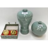 Two Celadon glazed vases decorated with cranes and a pair of chiming balls Condition Report: