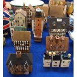 A collection of continental pottery models of houses which can be used as night lights Condition