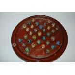 A collection of vintage marbles and solitaire board, marbles, 2cm diameter, solitaire board 30cm