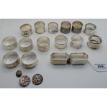A lot comprising a pair of silver napkin rings, Birmingham 1947, twelve other silver napkin rings (