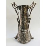An Art Nouveau white metal vase embossed with female figures and winged puti amid foliage with