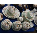 A Minton Haddon Hall dinner service comprising eight dinner plates, eight pudding bowls, six soup