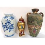 A Vienna porcelain urn and cover together with a pottery vase decorated with tulips and a Delft vase