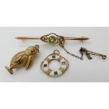 A 9ct peridot and pearl brooch, a yellow metal enamel and gemstone set life ring and a 9ct bird