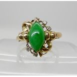 A bright yellow metal Chinese green hardstone and diamond accent ring, size S, weight 4gms Condition