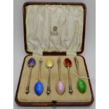 A cased set of six silver gilt and enamel coffee spoons, Birmingham 1937 Condition Report: Available