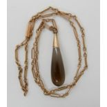 A 9ct gold vintage chain length 46cm with a yellow metal smoky quartz drop pendant length 4cm,