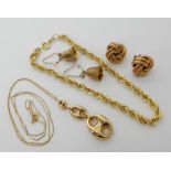A 9ct gold rope chain bracelet length 20cm, a 9ct marine chain link pendant length 3.5cm, with 9ct