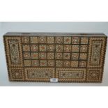 A 20th Century inlaid games box, 50cm wide Condition Report: Available upon request