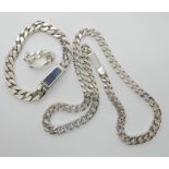 A suite of silver curb chain Gucci jewellery, comprising of a necklace bracelet and ring, in