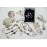 An early Malcolm Grey Ortak starburst brooch set with blue agates, Mackintosh style brooches and