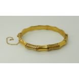 A 9ct gold bamboo pattern bangle, weight 9gms Condition Report: Available upon request