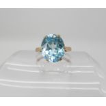 A yellow metal blue zircon ring, size O, weight 4gms Condition Report: Available upon request