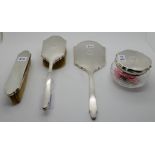A four piece silver dressing table set, Birmingham 1934 Condition Report: Available upon request