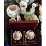 A boxed set containing two small ceramic dishes, two spoons stamped 925 and two horn spoons, all