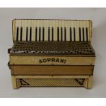 A Soprani accordion in cream and faux mother of pearl with case Condition Report: Available upon