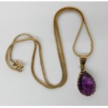 A 9ct gold herringbone chain length 38cm with a yellow metal mounted amethyst pendant length with