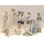 Eight assorted Lladro and Nao figures and another figure Condition Report: Available upon request