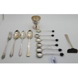 A lot comprising a silver egg cup, Birmingham 1937 and assorted silver spoons, a fork and a