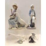 A Lladro figure of a girl and swan, another of a boy holding a boat and two other groups Condition