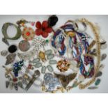 A collection of vintage costume jewellery to include Kramer, a large blue sugar glass and diamante
