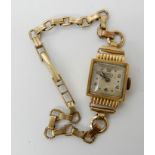 An 18ct gold Ramex watch head, with gold plated strap, weight including strap and mechanism 11.