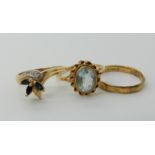 A 9ct sapphire and diamond accent ring size S1/2, a 9ct aquamarine ring size S1/2 and a 9ct