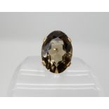 A 9ct large smoky quartz ring, approx 25mm x 18mm x 11.5mm, finger size K, weight 9.6gms Condition