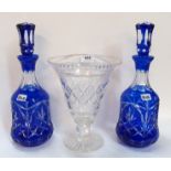 A pair of blue flashed and cut decanters and a cut glass vase Condition Report: Available upon