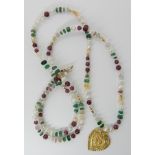 A 24k gold Chinese gold heart shaped pendant on a string of pearl emerald, ruby and other gemstone