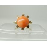 A bright yellow metal coral set ring, size K, weight 4.2gms Condition Report: Available upon