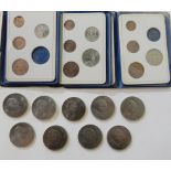 A lot comprising three sets of Britain's first decimal coins and a quantity of commemorative