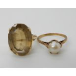 A 9ct gold smoky quartz ring size O1/2 and a 9ct gold pearl ring size R, combined weight 8.2gms