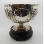 A silver rose bowl by Wakely & Wheeler, London 1908, of classic shape with frilled rim, embossed