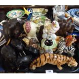 A collection of ebony elephants, a Beswick woodpecker, an Italian figure of a girl and other figures