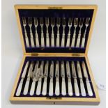 A cased twenty four piece EP and mother of pearl dessert cutlery set Condition Report: Available