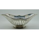 A silver bread basket by Martin Hall & Company, Sheffield 1906, boat shaped with strap sides, 25.5cm
