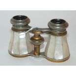 A pair of mother of pearl opera glasses Condition Report: Available upon request
