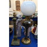 A brass Corinthian column table lamp together with a brass oil lamp Condition Report: Available upon