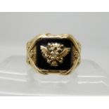 A 14k gold onyx and diamond set double eagle gents signet ring size R1/2, weight 14.1gms Condition