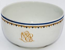 LNER china finger bowl with LNER in yellow script and yellow and blue pattern around the rim. Base